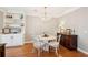 Bright dining room with a decorative chandelier, hardwood floors, and built-in shelving at 136 Fair Sailing Rd, Mount Pleasant, SC 29466