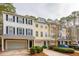 Attractive townhomes showcasing garages and beautifully landscaped front yards at 136 Fair Sailing Rd, Mount Pleasant, SC 29466