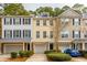 Charming townhouses with garages and well-manicured landscaping create a welcoming curb appeal at 136 Fair Sailing Rd, Mount Pleasant, SC 29466