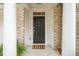 Welcoming front entrance with brick columns, a black door, and a patterned welcome mat at 136 Fair Sailing Rd, Mount Pleasant, SC 29466