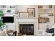 Living room showcasing a fireplace with mantel, surrounding shelving and modern decor at 136 Fair Sailing Rd, Mount Pleasant, SC 29466
