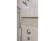 Close up of tiled shower stall with shower head, hand shower, and tiled soap nook at 136 Fair Sailing Rd, Mount Pleasant, SC 29466