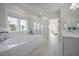 Bright bathroom features a soaking tub, separate shower, and natural light from large windows at 1464 Stratton Pl, Mount Pleasant, SC 29466