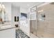 Bright bathroom featuring a standalone bathtub, glass enclosed shower, and granite countertops at 1710 Sparkleberry Ln, Johns Island, SC 29455