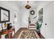 Elegant entryway with hardwood floors, stylish decor, and a staircase leading to the upper level at 1710 Sparkleberry Ln, Johns Island, SC 29455
