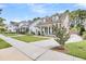 Picturesque street view showcases well-manicured lawns and charming homes in a peaceful neighborhood at 1710 Sparkleberry Ln, Johns Island, SC 29455