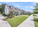 Beautiful street featuring well-maintained homes, lush green lawns, and vibrant landscaping at 1710 Sparkleberry Ln, Johns Island, SC 29455