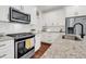 Well-lit kitchen with stainless steel appliances, white subway tile backsplash, and granite countertops at 1710 Sparkleberry Ln, Johns Island, SC 29455