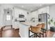 Bright kitchen island with bar seating, stainless steel appliances, and ample cabinet space at 1710 Sparkleberry Ln, Johns Island, SC 29455