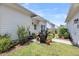 Back patio with outdoor furniture, greenery, and a well-manicured lawn at 1710 Sparkleberry Ln, Johns Island, SC 29455