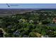 Picturesque aerial view of a lakefront community near Sullivan's Island surrounded by mature trees and waterways at 1784 Omni Blvd, Mount Pleasant, SC 29466