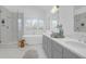 Bright bathroom with soaking tub, glass enclosed shower, and double sinks at 1784 Omni Blvd, Mount Pleasant, SC 29466