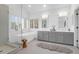 Bright bathroom featuring a soaking tub and double vanity sink at 1784 Omni Blvd, Mount Pleasant, SC 29466