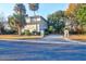 Lovely home with a spacious driveway, mature trees and lush landscaping at 1784 Omni Blvd, Mount Pleasant, SC 29466