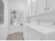 Functional laundry room featuring white appliances and ample storage at 1784 Omni Blvd, Mount Pleasant, SC 29466