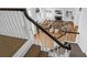 View of the living room from the staircase landing with a fireplace and hardwood floors at 1784 Omni Blvd, Mount Pleasant, SC 29466