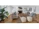 Cozy living room with hardwood floors, a fireplace, and ample natural light at 1784 Omni Blvd, Mount Pleasant, SC 29466