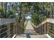 Scenic wooden boardwalk leading to a picturesque view, inviting residents to explore nature at 1784 Omni Blvd, Mount Pleasant, SC 29466