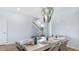 Bright dining area showcases elegant light fixture, table set for eight, and staircase view at 200 Pine Crest View Dr, Summerville, SC 29486