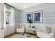 Cozy room features light blue striped walls, white wainscoting, and a modern light fixture at 200 Pine Crest View Dr, Summerville, SC 29486