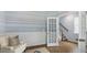 Inviting room boasts hardwood floors, a chair rail, and a staircase with a light blue painted wall at 200 Pine Crest View Dr, Summerville, SC 29486