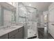 Modern bathroom showcasing glass shower, gray vanity with granite countertop, and tile flooring at 2006 Barn Swallow Rd, Summerville, SC 29483
