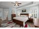 Spacious bedroom features wood floors, tray ceiling, wood furniture, and a colorful rug at 2006 Barn Swallow Rd, Summerville, SC 29483