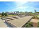 Scenic view of bocce ball courts near the clubhouse in a well-maintained and active community at 2006 Barn Swallow Rd, Summerville, SC 29483