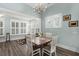 Cozy dining area with hardwood floors, natural light, and contemporary decor, perfect for meals and gatherings at 2006 Barn Swallow Rd, Summerville, SC 29483