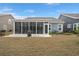 Backyard with a screened-in porch, patio, well-maintained lawn, and exterior views of the house at 2006 Barn Swallow Rd, Summerville, SC 29483