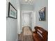 Bright hallway with wood floors, neutral paint, and stylish decor at 2006 Barn Swallow Rd, Summerville, SC 29483