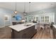 Open floor plan seamlessly connects the kitchen, dining, and living areas, creating an inviting space at 2006 Barn Swallow Rd, Summerville, SC 29483