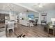 Bright, open-concept living area connects kitchen, dining, and living spaces for modern living and entertaining at 2006 Barn Swallow Rd, Summerville, SC 29483