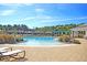 A stunning pool with a brick deck, lounge chairs, and lush landscaping is the perfect place to relax and enjoy the sunshine at 2006 Barn Swallow Rd, Summerville, SC 29483