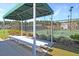 Comfortable bench seating under a shaded structure overlooking the community tennis courts at 2006 Barn Swallow Rd, Summerville, SC 29483