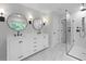 Modern bathroom boasts dual sinks, a vanity, framed mirrors, and a glass-enclosed shower at 2010 Mcguire Ln # 003, Hollywood, SC 29449