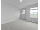 Carpeted bedroom with two windows providing natural light and neighborhood views at 2010 Mcguire Ln # 003, Hollywood, SC 29449