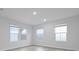 Bright bedroom with three large windows offering pleasant views and natural lighting at 2010 Mcguire Ln # 003, Hollywood, SC 29449