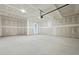 Spacious garage with unfinished drywall, high ceilings, and concrete flooring at 2010 Mcguire Ln # 003, Hollywood, SC 29449