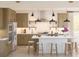 Bright kitchen with stainless steel appliances, a large center island with seating, and stylish pendant lighting at 2010 Mcguire Ln # 003, Hollywood, SC 29449