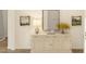 Stylish entryway featuring a decorative cabinet, mirror, and neutral decor at 2018 Mcguire Ln # 005, Hollywood, SC 29449