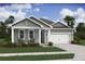 Charming home with a two-car garage, inviting porch, and well-manicured lawn at 2018 Mcguire Ln # 005, Hollywood, SC 29449