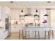 Bright, stylish kitchen featuring a large island with seating, stainless steel appliances, and modern lighting at 2018 Mcguire Ln # 005, Hollywood, SC 29449