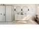 Modern bathroom featuring double sinks, round mirrors, decorative tile floor, and a glass enclosed shower at 2022 Mcguire Ln # 006, Hollywood, SC 29449