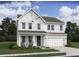 Charming two-story home with white siding, a welcoming porch, and a two car garage at 2022 Mcguire Ln # 006, Hollywood, SC 29449