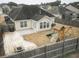Aerial view of a backyard with a patio, playground, and fenced yard at 203 Goldfinch Ln, Summerville, SC 29485
