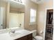 The bathroom features a functional layout with a white sink, toilet, and shower-tub combo at 203 Goldfinch Ln, Summerville, SC 29485