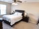 This bedroom is a tranquil retreat with natural light from the window, and features a ceiling fan and nightstands at 203 Goldfinch Ln, Summerville, SC 29485