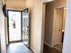 Inviting entryway with an open front door and a view into another room at 203 Goldfinch Ln, Summerville, SC 29485