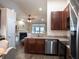 A kitchen is featuring stainless steel appliances, ample countertop space, and views into the living room at 203 Goldfinch Ln, Summerville, SC 29485